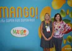 Tammy Wiard and Michelle Larkin in the colorful booth of the National Mango Board.